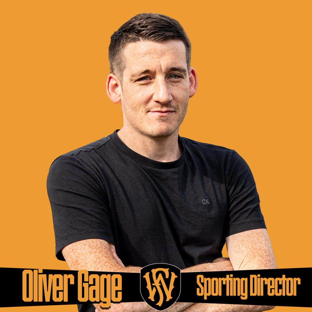 A man stands with arms crossed in front of an orange background wearing a black shirt. The graphic includes the Fort Wayne FC logo and text reading “Oliver Gage | Sporting Director.” Promotional image highlighting Fort Wayne FC’s sporting leadership and team management.