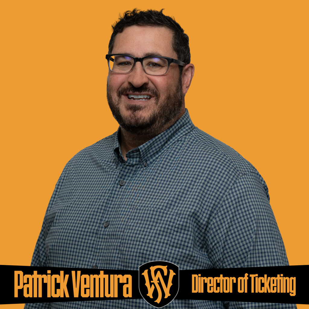A smiling man wearing glasses and a checkered button-down shirt stands in front of an orange background. The graphic includes the Fort Wayne FC logo and text reading “Patrick Ventura | Director of Ticketing.” Promotional image featuring Fort Wayne FC’s ticketing and fan experience leadership.